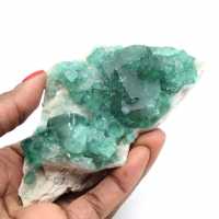 Raw natural fluorite in green crystals