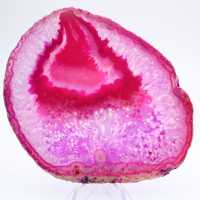 Polished slice of pink-tinted agate