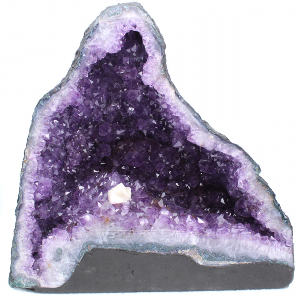 Amethyst geode with calcite crystal