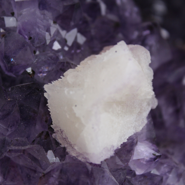 Amethyst geode with calcite crystal