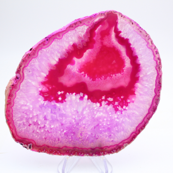 Polished slice of pink-tinted agate