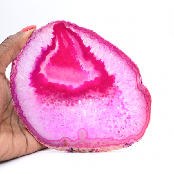 Polished slice of pink-tinted agate