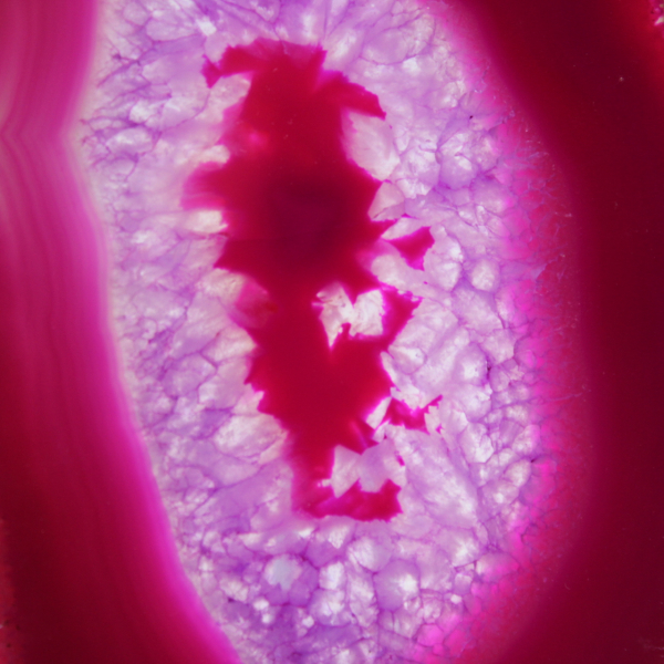 Polished slice of dyed pink agate