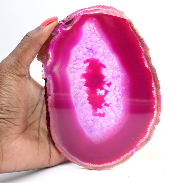 Polished slice of dyed pink agate