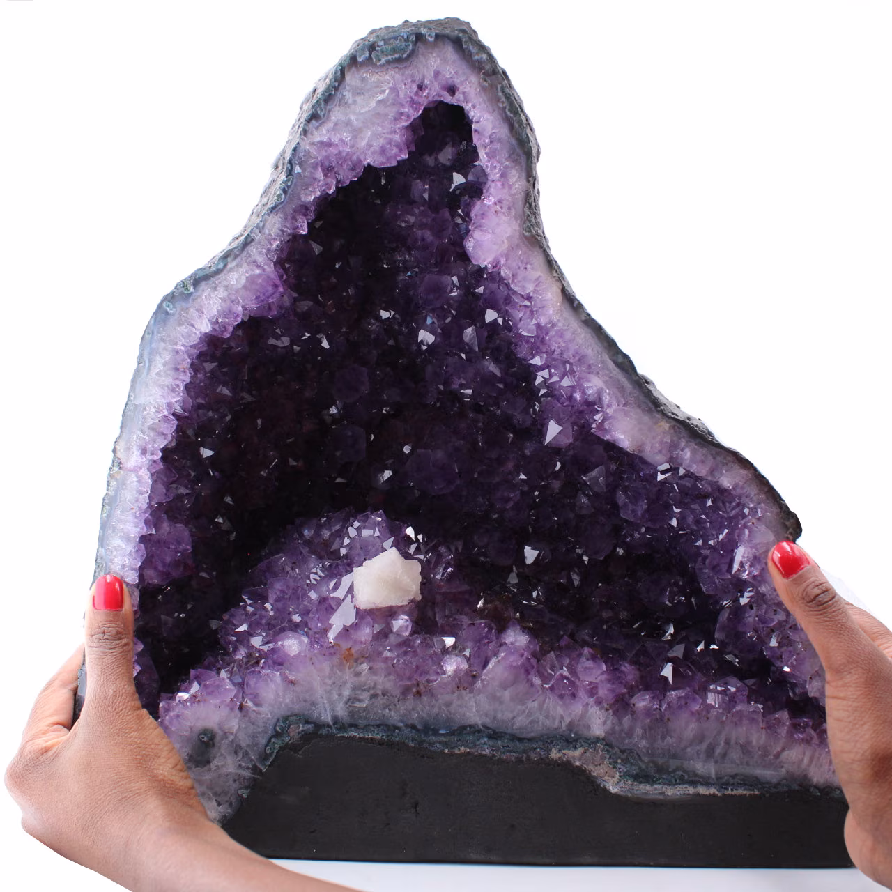 Amethyst geode with calcite crystal