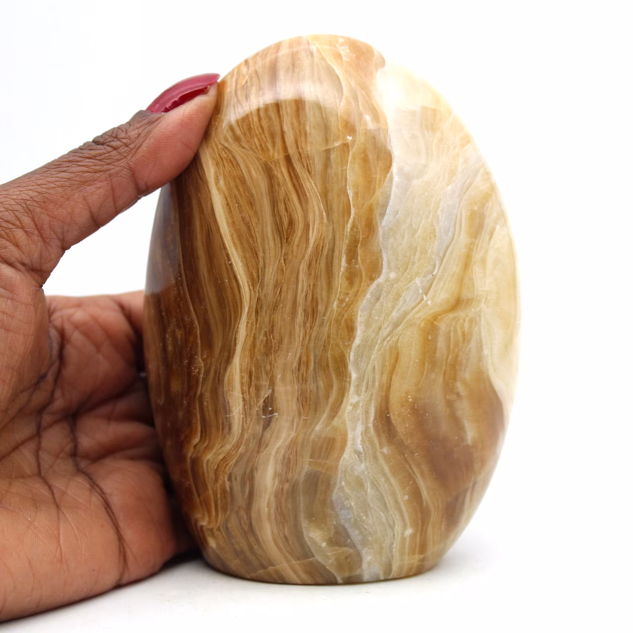 Polished freeform honey calcite