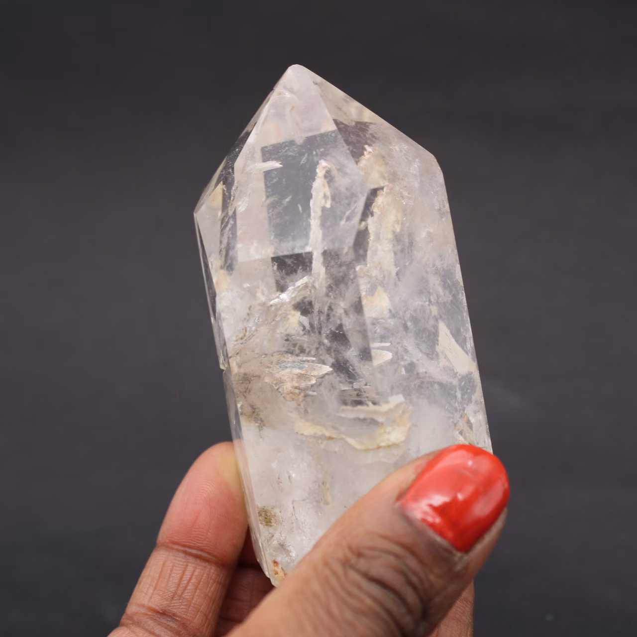 Quartz crystal prism with inclusion