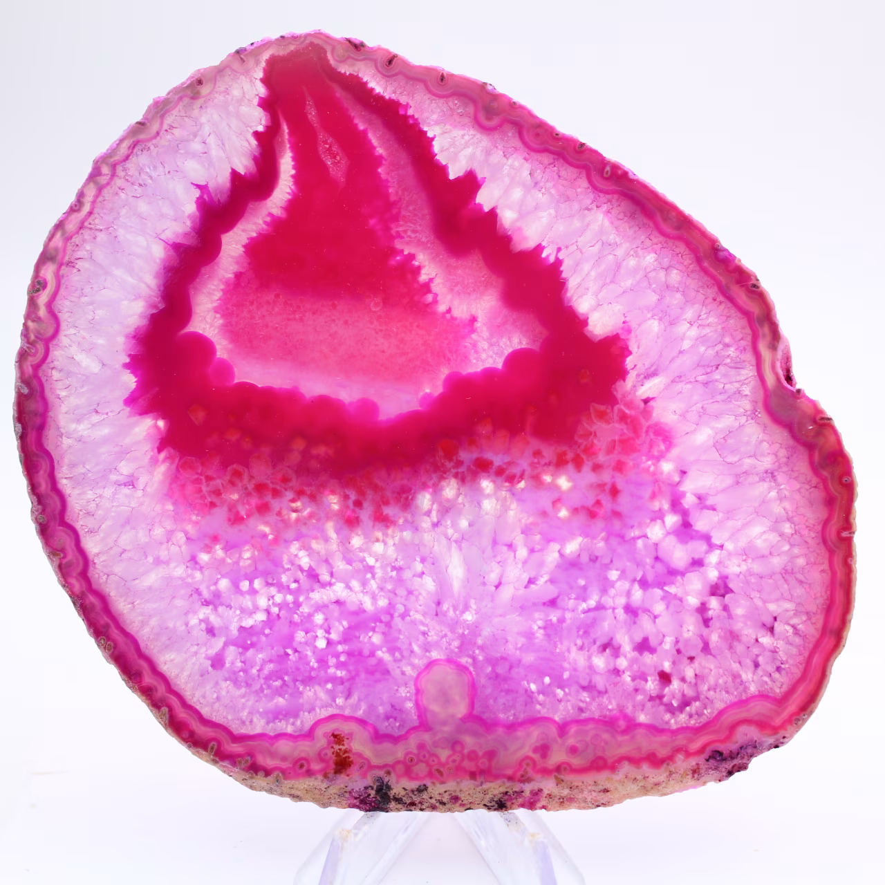 Polished slice of pink-tinted agate