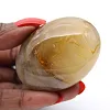 Yellow quartz pebble from Madagascar with soft contours - 2