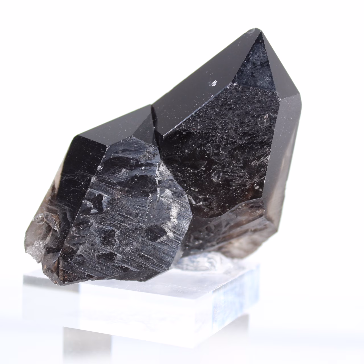 Small natural morion quartz crystal from Brazil on acrylic base