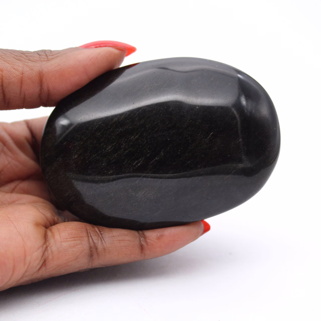 Mexican golden obsidian pebble, elongated 100 g piece