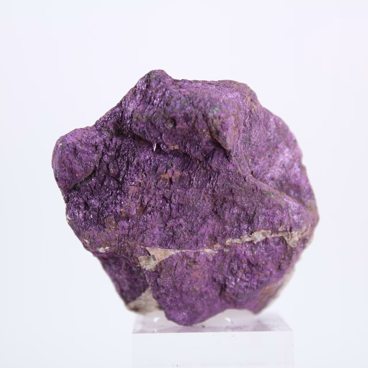 Raw Purpurite from Portugal on stand – Mineral specimen